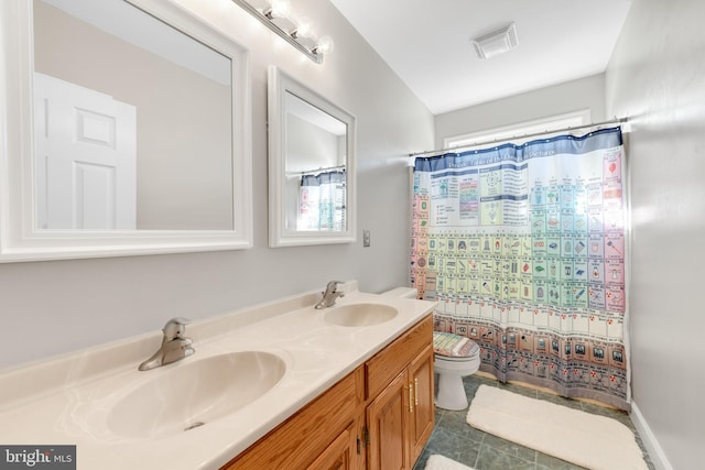 bathroom featuring toilet, vanity, and walk in shower