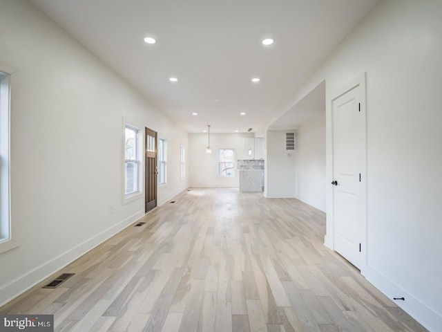 unfurnished living room featuring light hardwood / wood-style floors