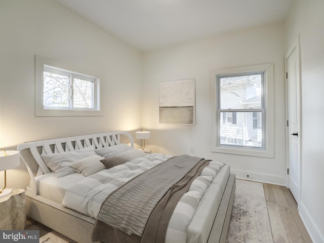 bedroom with light wood-type flooring