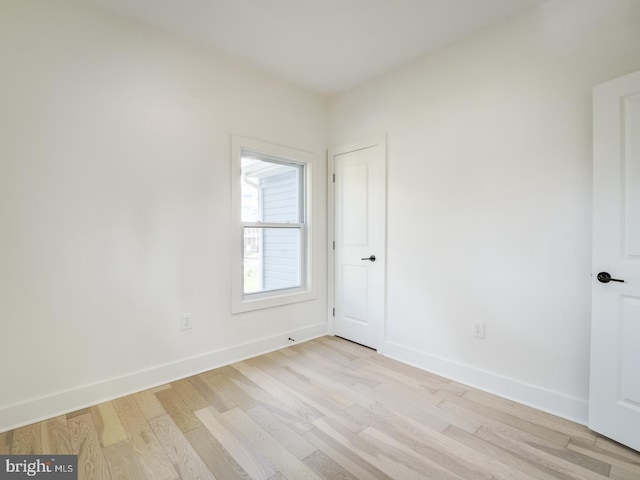 empty room with light hardwood / wood-style floors