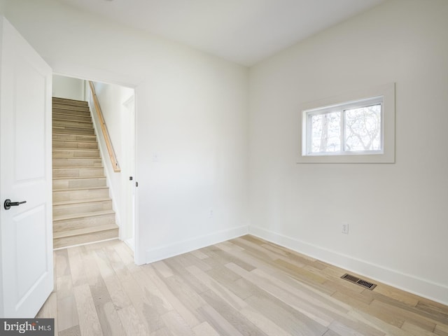 unfurnished room with light hardwood / wood-style flooring