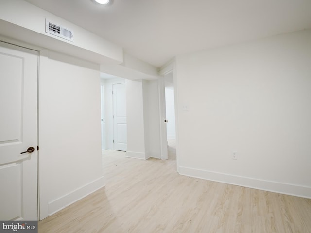 unfurnished room with light hardwood / wood-style floors