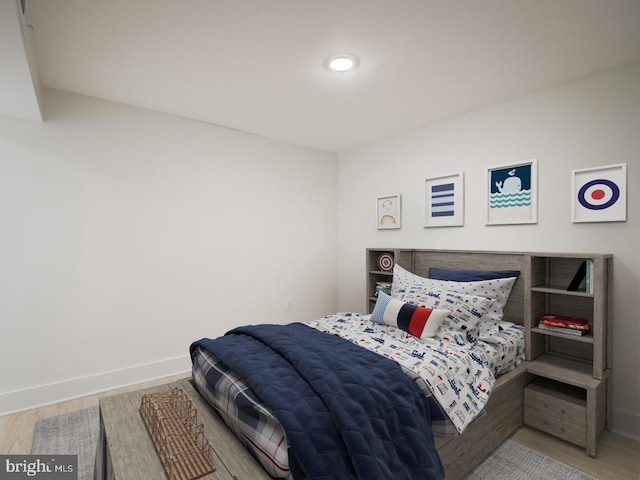 bedroom with wood-type flooring