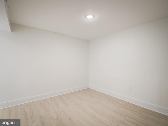 unfurnished room with light hardwood / wood-style floors