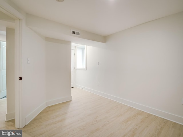 unfurnished room with light hardwood / wood-style flooring