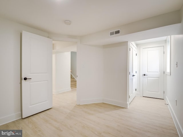 spare room with light hardwood / wood-style floors