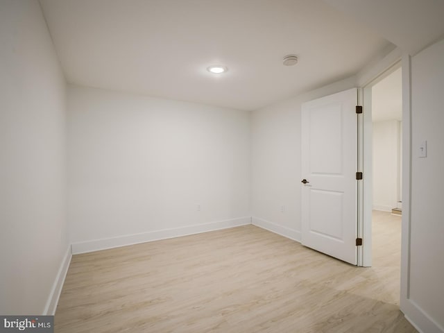 spare room featuring light hardwood / wood-style flooring