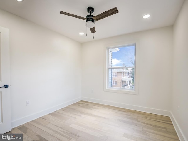 unfurnished room with light hardwood / wood-style flooring and ceiling fan