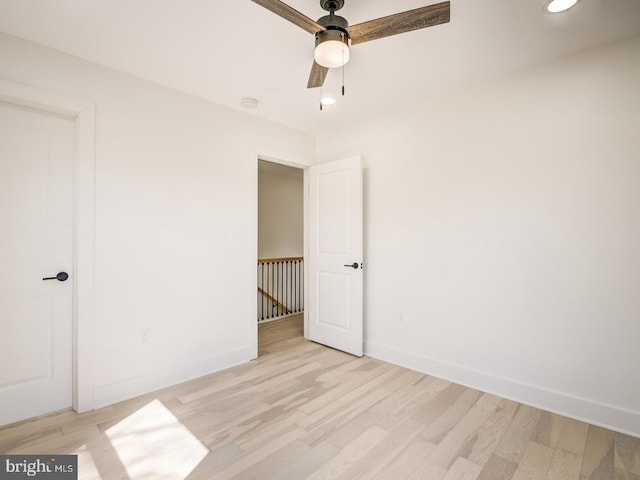 unfurnished bedroom with light hardwood / wood-style floors and ceiling fan