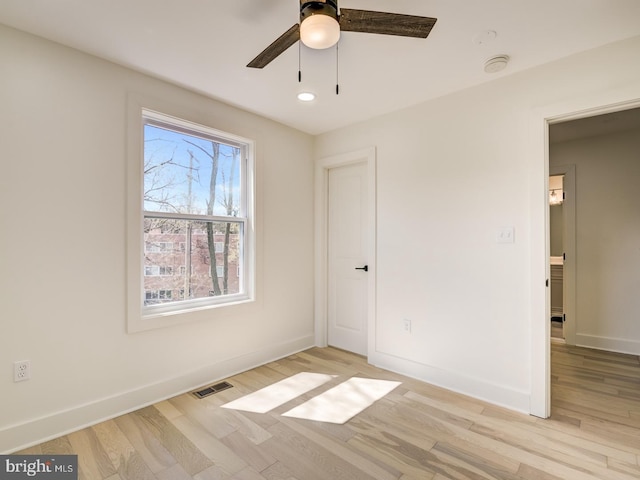 unfurnished bedroom featuring light wood-type flooring and ceiling fan