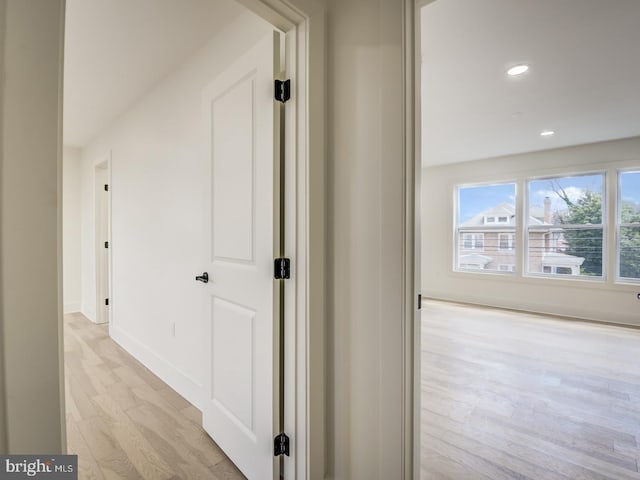 hall with light wood-type flooring