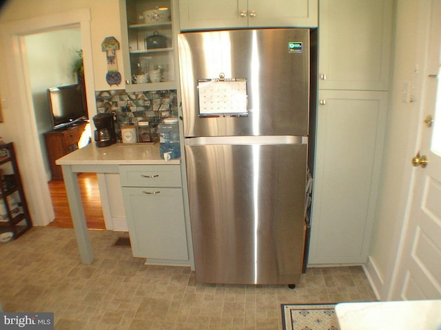 kitchen featuring stainless steel refrigerator