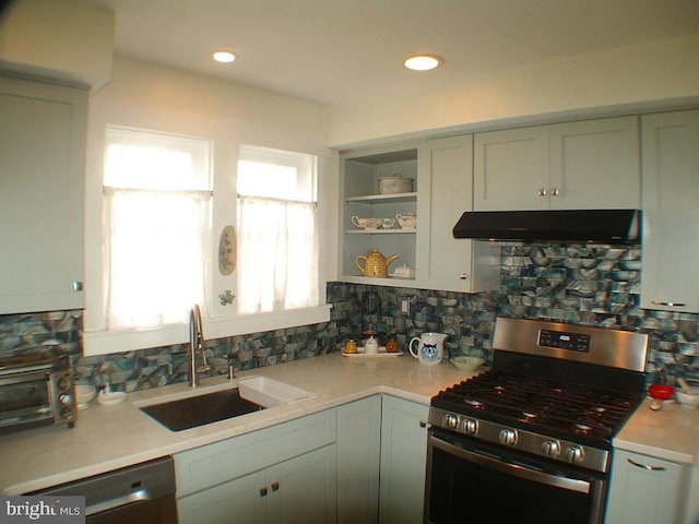 kitchen with appliances with stainless steel finishes, tasteful backsplash, and range hood