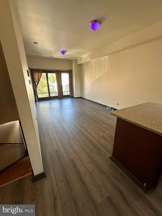 unfurnished room featuring dark hardwood / wood-style flooring