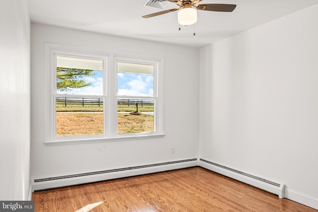 unfurnished room with ceiling fan, plenty of natural light, and light wood-type flooring