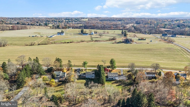 birds eye view of property with a rural view