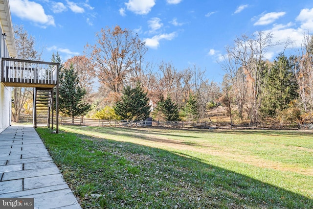 view of yard featuring a wooden deck