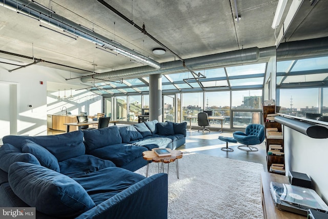 living room with concrete flooring and sink