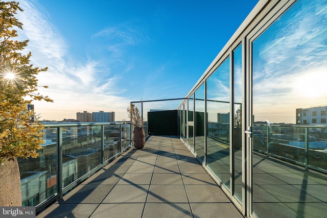 view of balcony at dusk