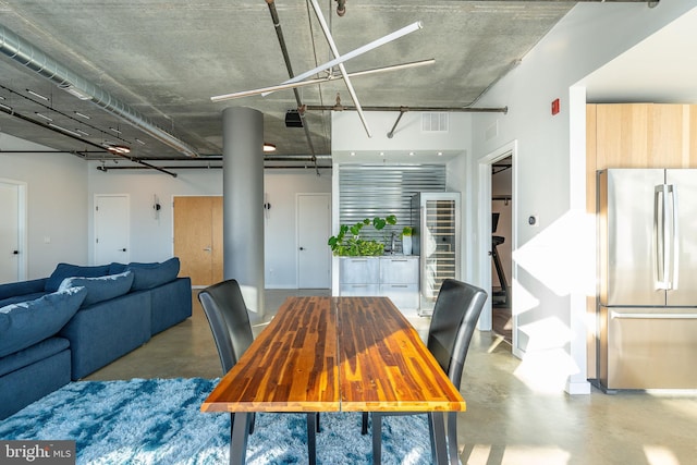 dining area featuring concrete flooring