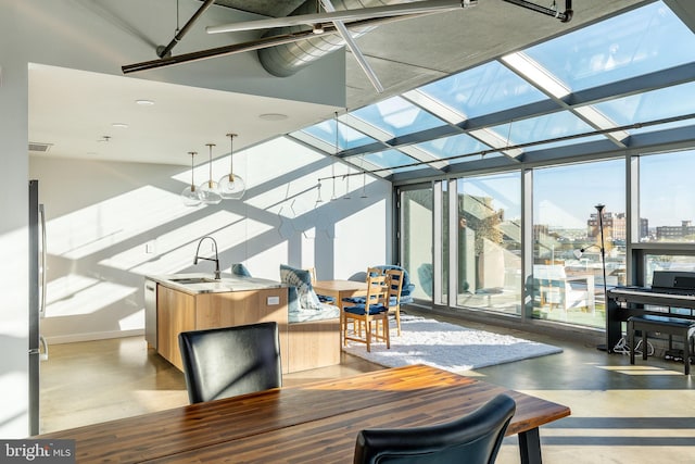 sunroom featuring sink and a healthy amount of sunlight