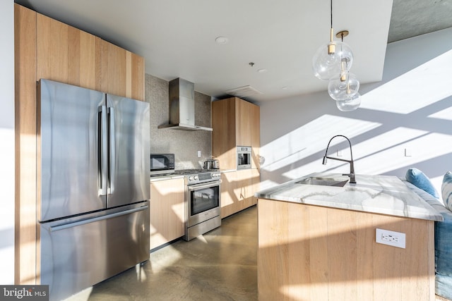 kitchen featuring backsplash, wall chimney exhaust hood, stainless steel appliances, sink, and hanging light fixtures