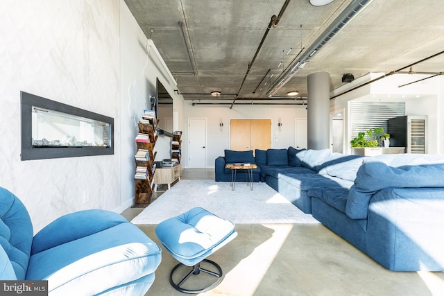 living room featuring concrete flooring