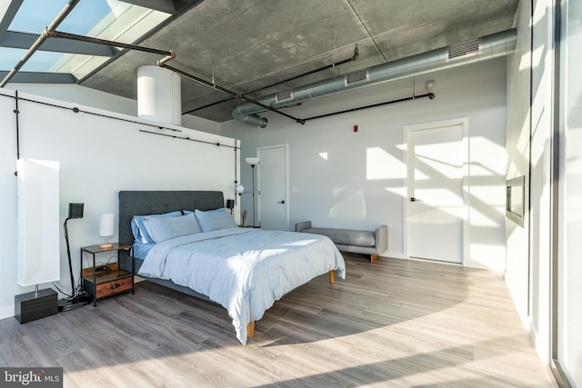 bedroom with hardwood / wood-style floors