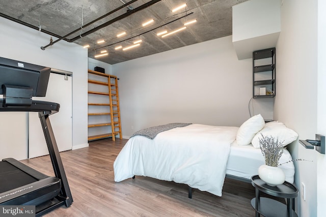 bedroom featuring hardwood / wood-style flooring