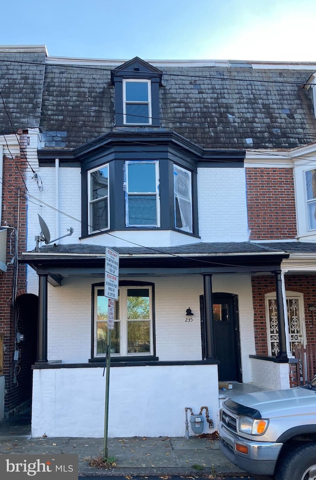 townhome / multi-family property with covered porch