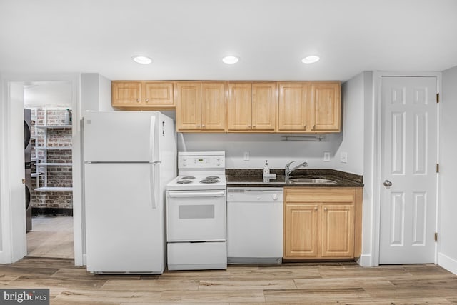 kitchen with light wood-type flooring, white appliances, sink, and light brown cabinetry