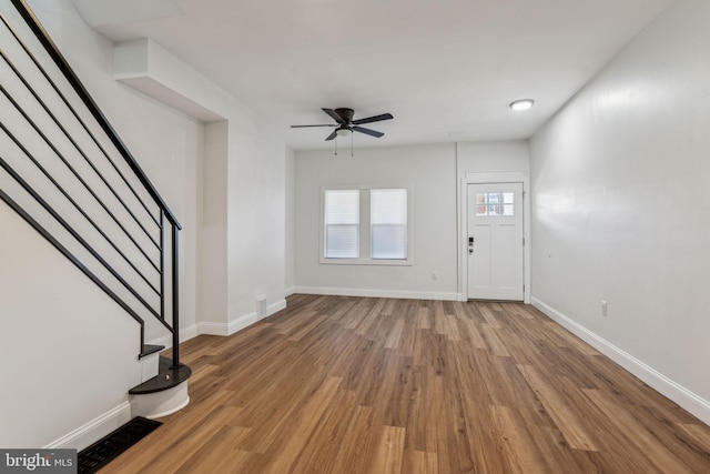 foyer entrance featuring hardwood / wood-style flooring and ceiling fan