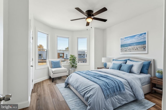 bedroom featuring hardwood / wood-style floors and ceiling fan