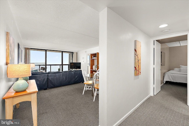 carpeted bedroom featuring a textured ceiling