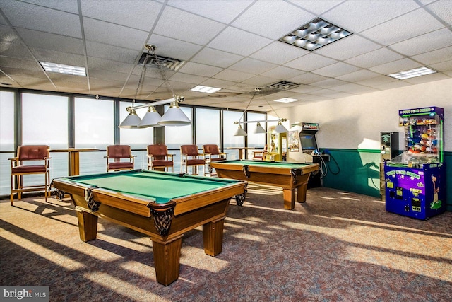 recreation room featuring pool table, a drop ceiling, floor to ceiling windows, and carpet