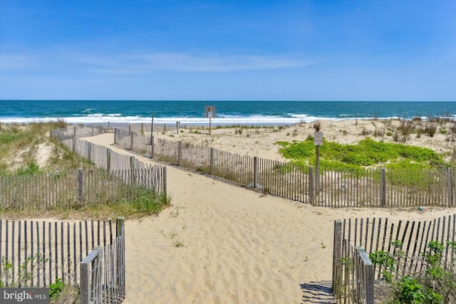 property view of water featuring a beach view