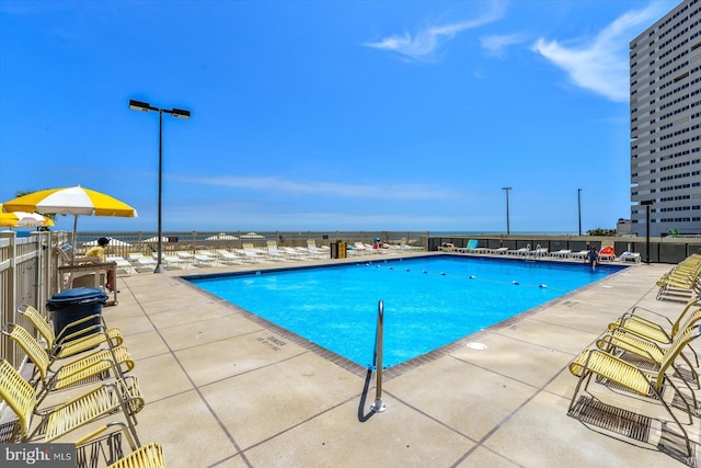 view of swimming pool featuring a patio