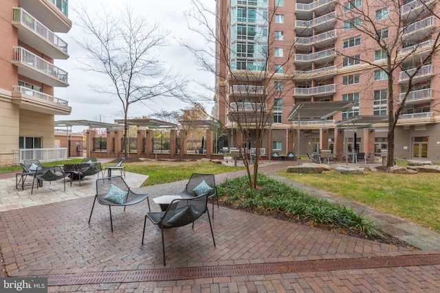 surrounding community featuring a patio