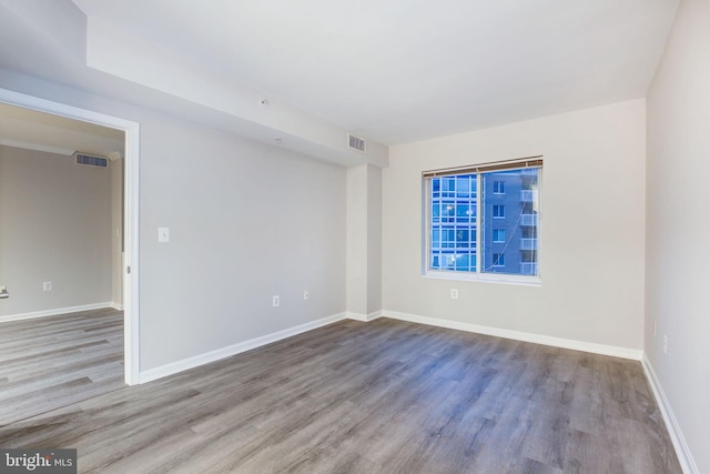 unfurnished room featuring wood-type flooring