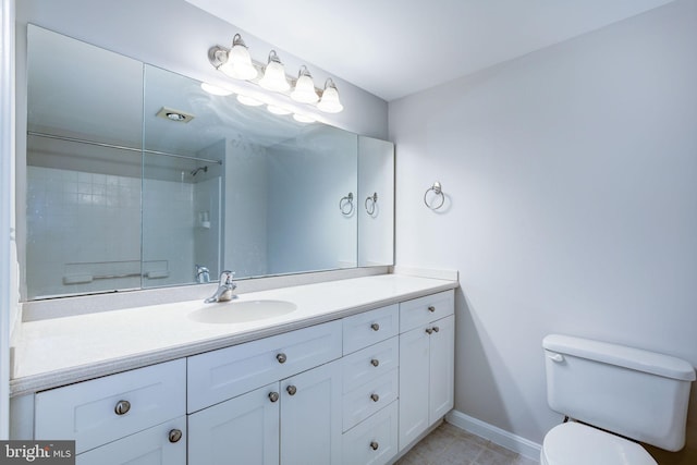 bathroom with tile patterned floors, vanity, and toilet