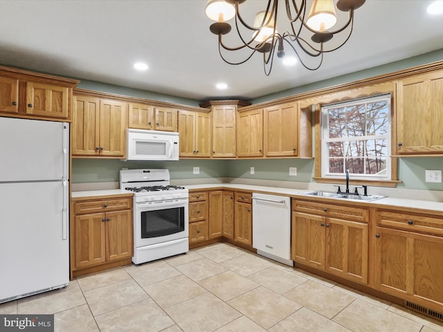 kitchen featuring white appliances, sink, pendant lighting, light tile patterned floors, and a chandelier