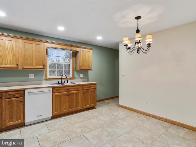 kitchen with white dishwasher, sink, pendant lighting, light tile patterned floors, and a chandelier