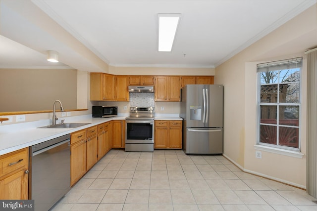 kitchen featuring light tile patterned flooring, appliances with stainless steel finishes, crown molding, and sink