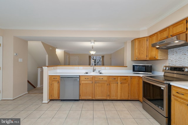 kitchen featuring hanging light fixtures, crown molding, sink, appliances with stainless steel finishes, and kitchen peninsula