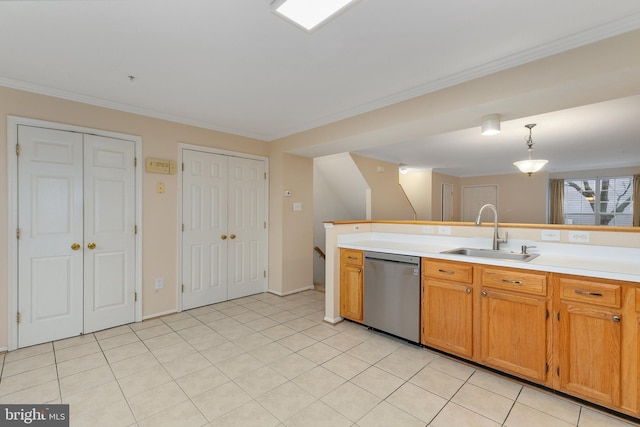 kitchen featuring light tile patterned floors, stainless steel dishwasher, hanging light fixtures, and sink