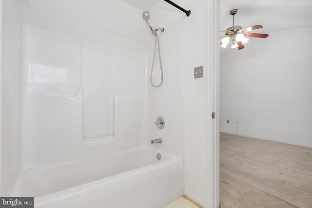 bathroom with shower / bathing tub combination and ceiling fan