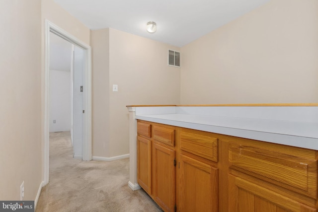 kitchen with light carpet