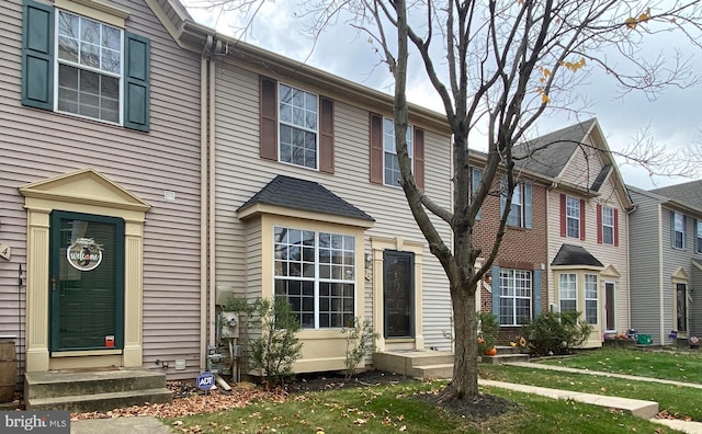 view of property with a front lawn