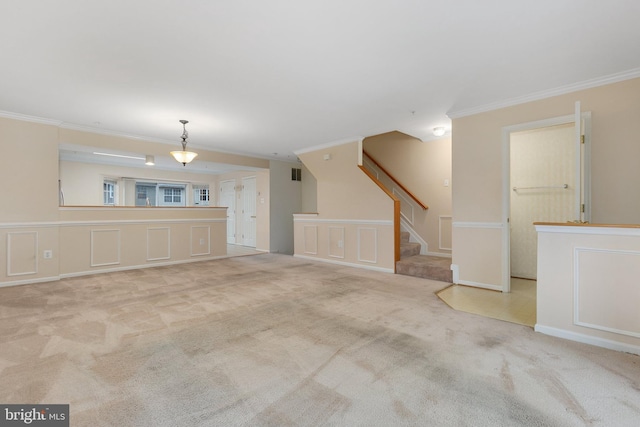 unfurnished living room featuring crown molding and light carpet