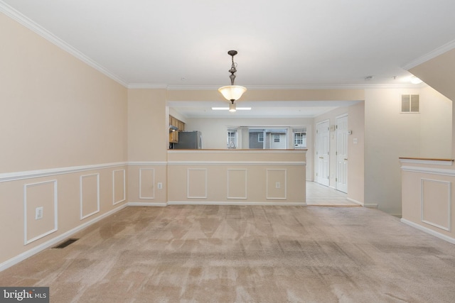 interior space featuring light carpet and crown molding